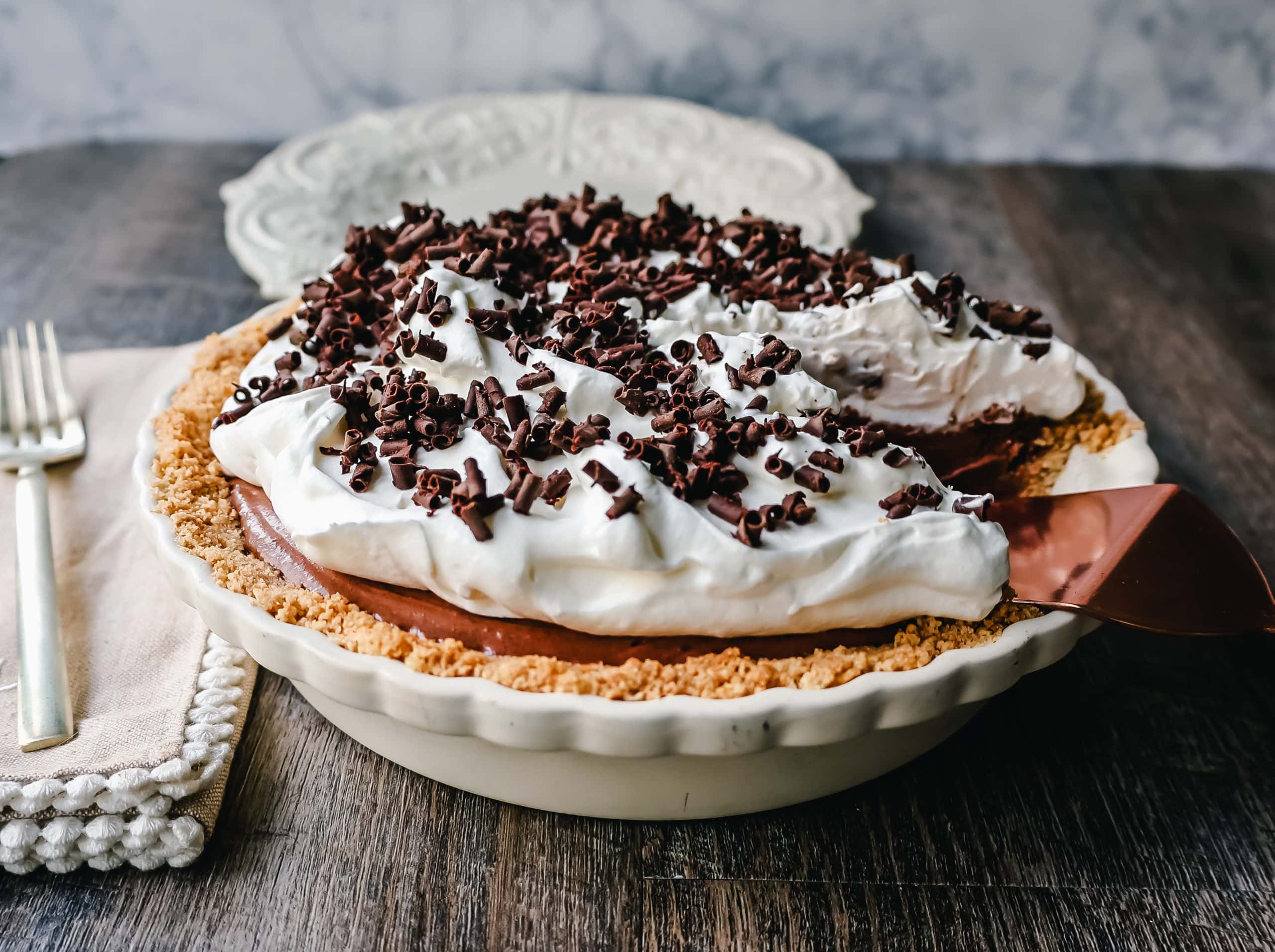 French Silk Pie Rich, creamy chocolate cream topped with fresh whipped cream and chocolate shaving all in a buttery graham cracker crust.