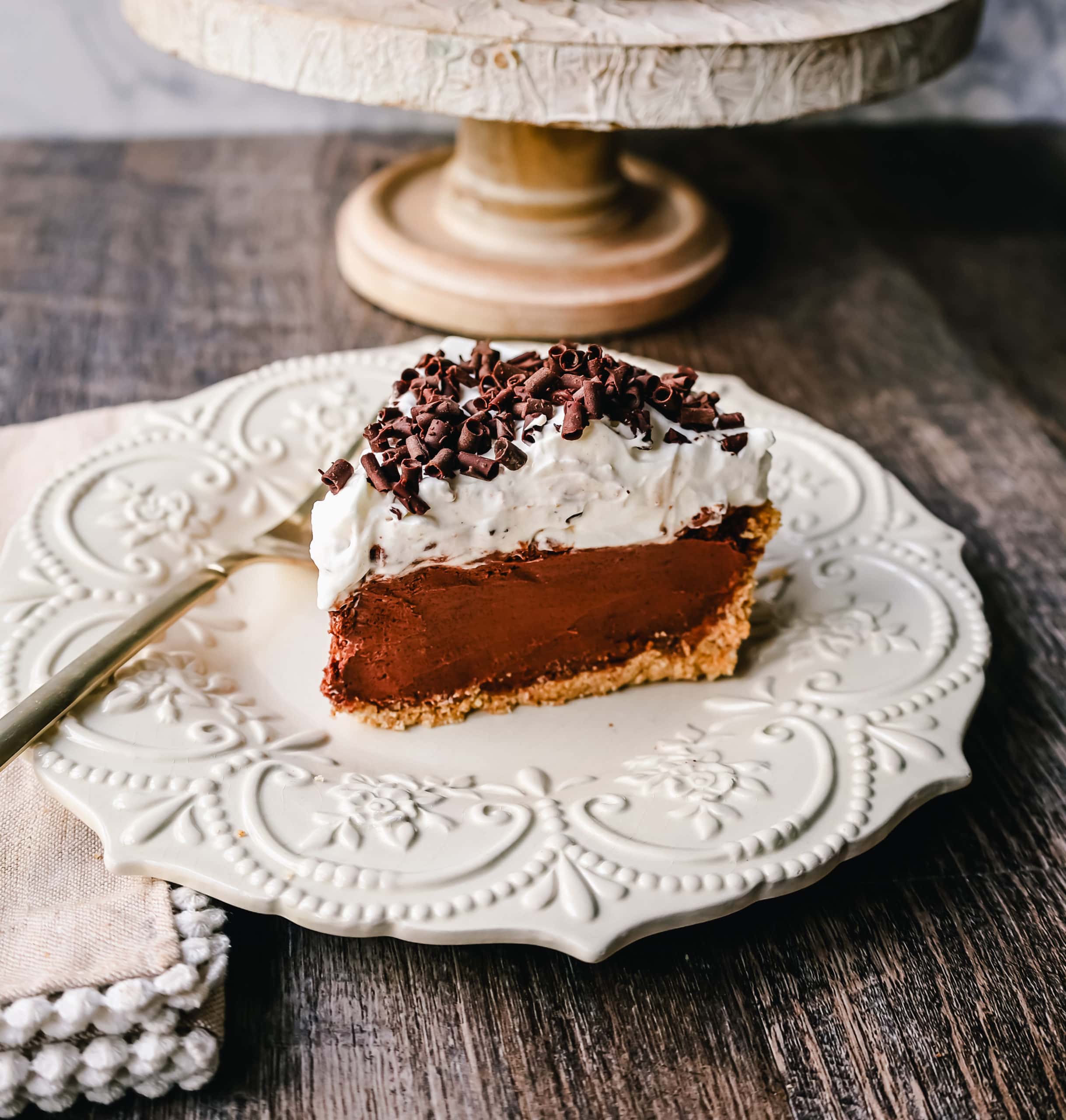 French Silk Pie Rich, creamy chocolate cream topped with fresh whipped cream and chocolate shaving all in a buttery graham cracker crust.