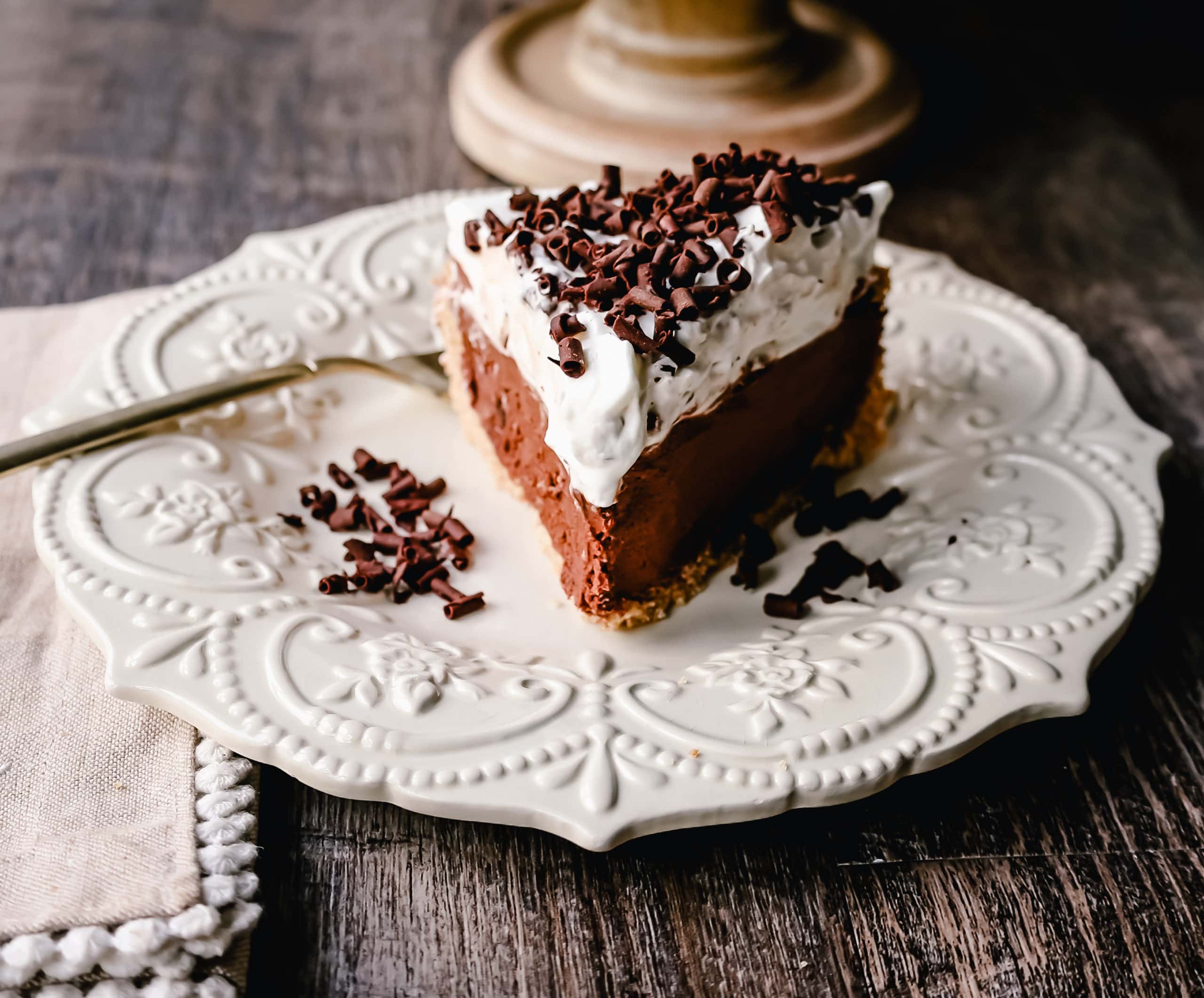 French Silk Pie Rich, creamy chocolate cream topped with fresh whipped cream and chocolate shaving all in a buttery graham cracker crust.