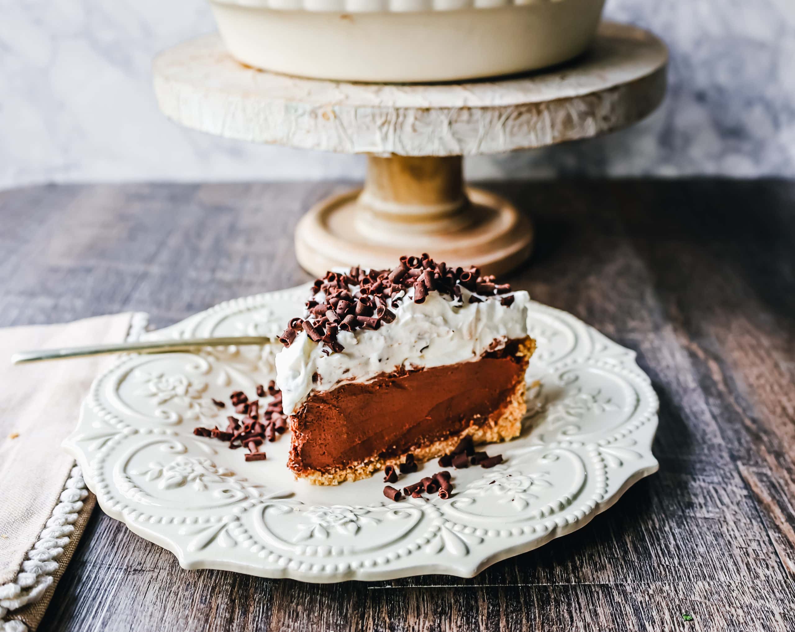 French Silk Pie Rich, creamy chocolate cream topped with fresh whipped cream and chocolate shaving all in a buttery graham cracker crust.