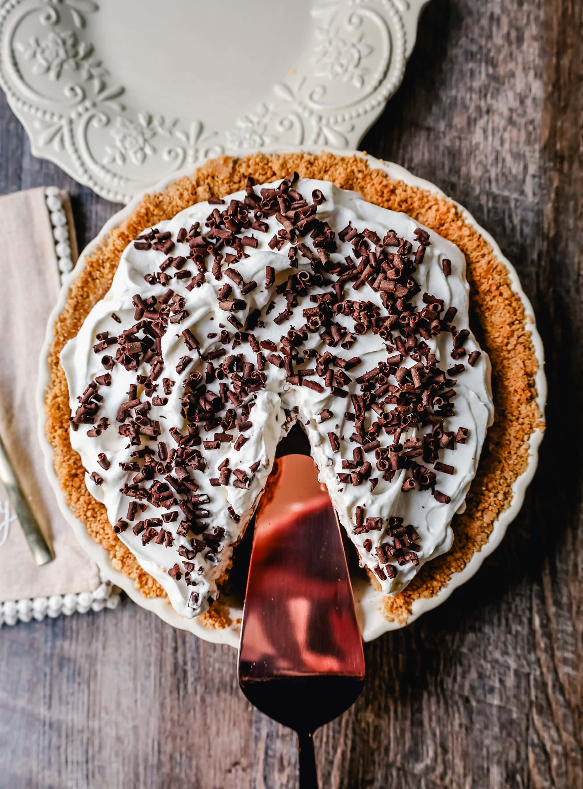 French Silk Pie Rich, creamy chocolate cream topped with fresh whipped cream and chocolate shaving all in a buttery graham cracker crust.