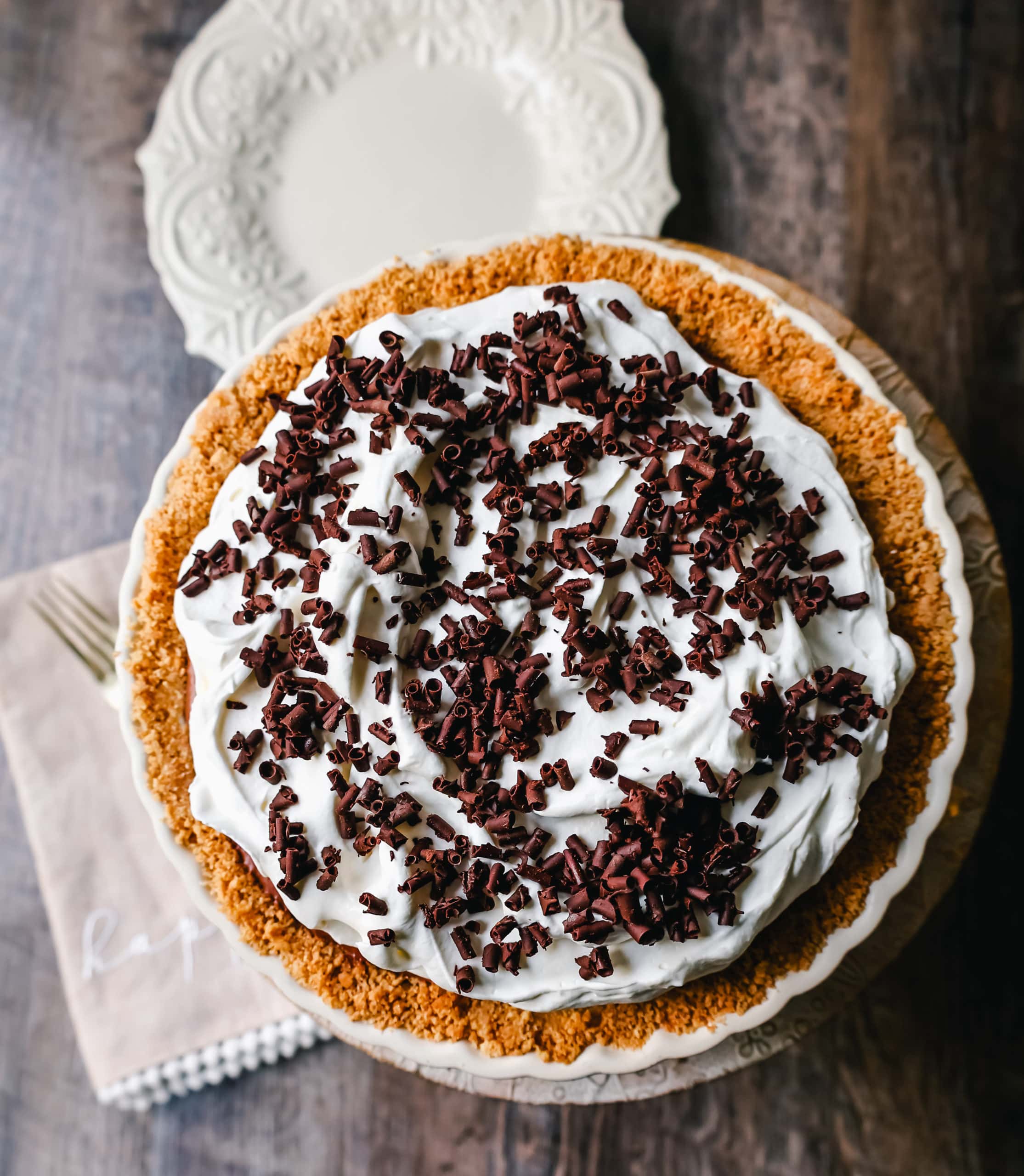 French Silk Pie Rich, creamy chocolate cream topped with fresh whipped cream and chocolate shaving all in a buttery graham cracker crust.