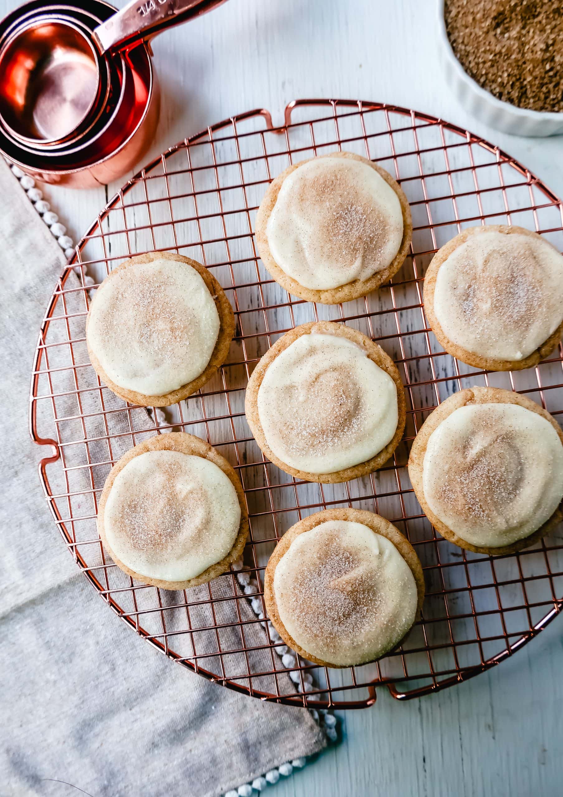 Frosted Snickerdoodle Cookies Soft, chewy cinnamon sugar snickerdoodle cookies topped with a sweet buttery cream cheese frosting and topped with a sprinkle of cinnamon sugar.