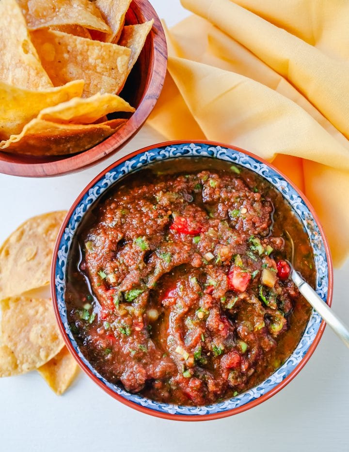 Easy Homemade Salsa made with tomatoes, cilantro, jalapeno, green chilies, green onions, and salt. This is the quickest homemade salsa and can be made in a blender in 5 minutes!