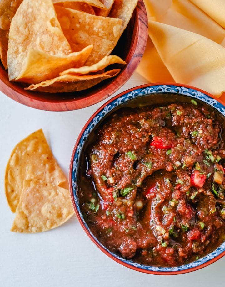 Easy Homemade Salsa made with tomatoes, cilantro, jalapeno, green chilies, green onions, and salt. This is the quickest homemade salsa and can be made in a blender in 5 minutes!