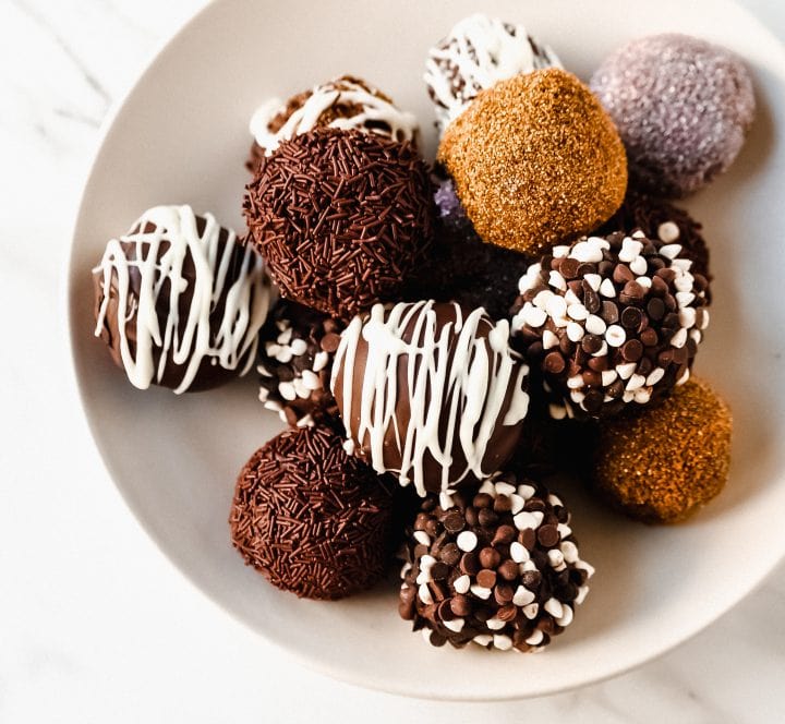 Chocolate Truffles. Rich, creamy, decadent homemade chocolate truffles made with high-quality chocolate, heavy cream, and a touch of butter rolled into your favorite toppings.
