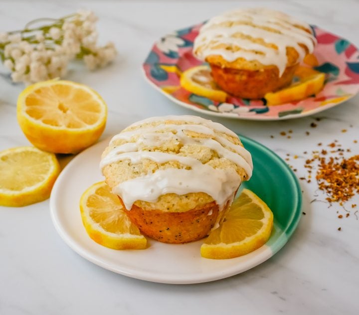 The most tender, moist, light, fluffy, and tangy lemon poppyseed muffins with a sweet lemon glaze. The best lemon poppyseed muffin recipe!