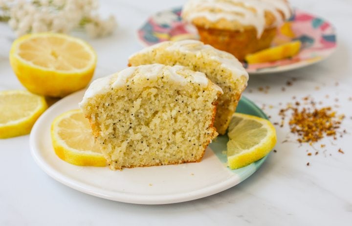 The most tender, moist, light, fluffy, and tangy lemon poppyseed muffins with a sweet lemon glaze. The best lemon poppyseed muffin recipe!