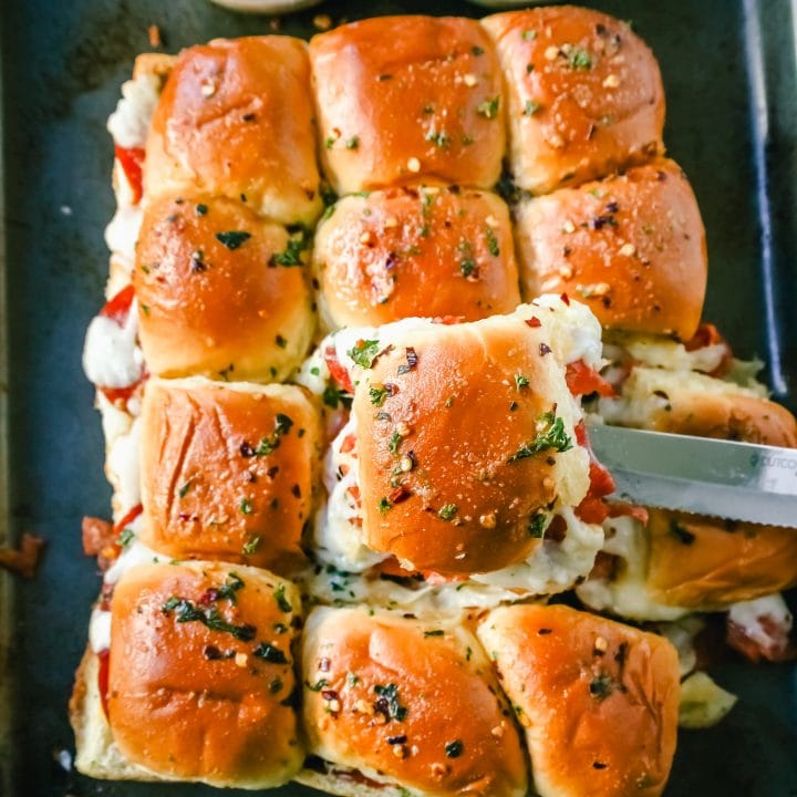 Pizza Sliders. Hawaiian Rolls Pizza Sliders made with Pepperoni, Mozzarella Cheese, and Provolone Cheese baked inside of soft, sweet rolls topped with warmed garlic butter and dipped in marinara sauce. The perfect party food!