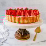 This Strawberry Cream Cheese Tart is made with a buttery tart crust, sweet vanilla cream cheese filling, and fresh strawberries with a shiny glaze. The perfect easy Summer strawberry dessert.