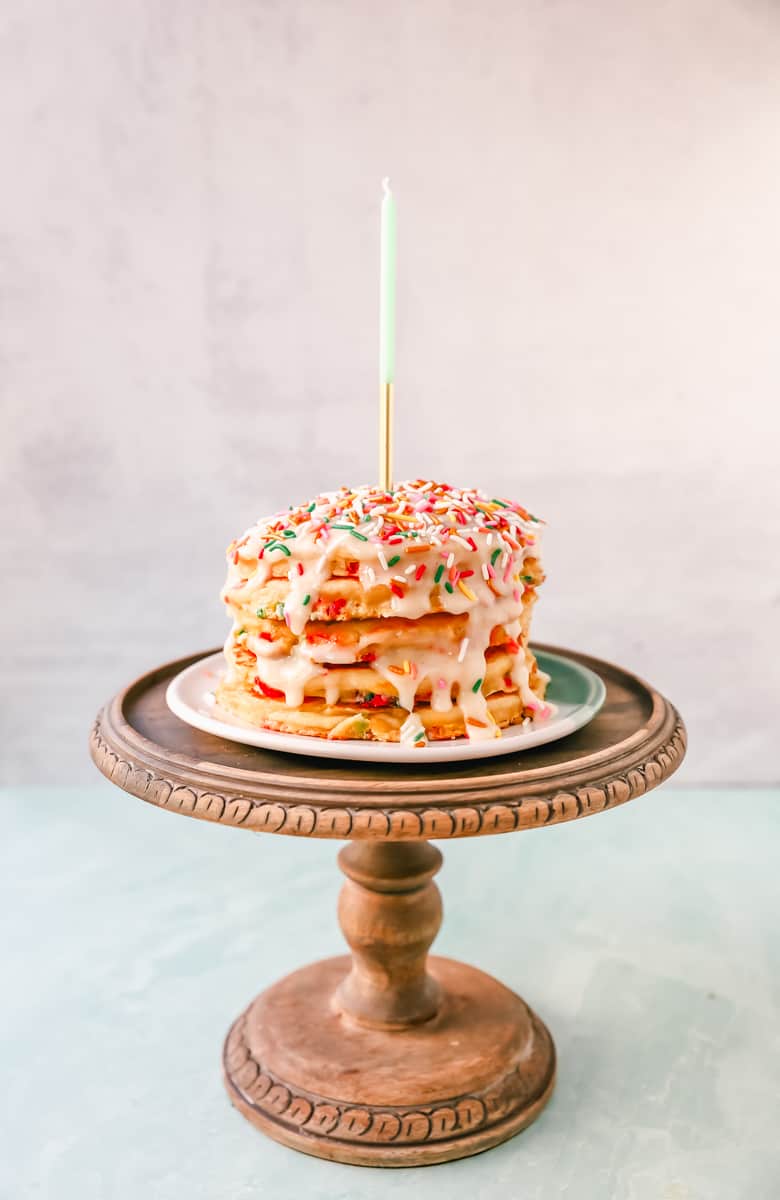 Light, Fluffy Buttermilk Pancakes with Sprinkles and topped with a Cream Cheese Glaze. The perfect Birthday Pancakes Recipe! A knock-off of the famous IHOP's Cupcake Pancakes.