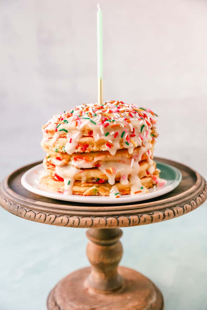 Light, Fluffy Buttermilk Pancakes with Sprinkles and topped with a Cream Cheese Glaze. The perfect Birthday Pancakes Recipe! A knock-off of the famous IHOP's Cupcake Pancakes.