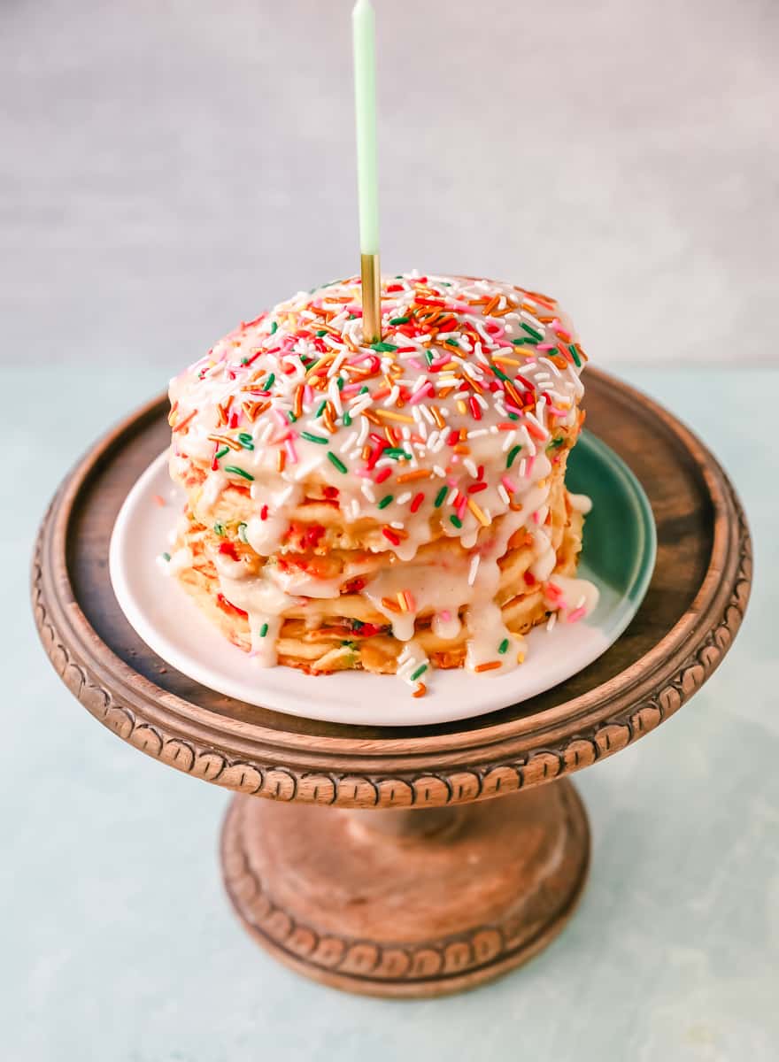 Light, Fluffy Buttermilk Pancakes with Sprinkles and topped with a Cream Cheese Glaze. The perfect Birthday Pancakes Recipe! A knock-off of the famous IHOP's Cupcake Pancakes.