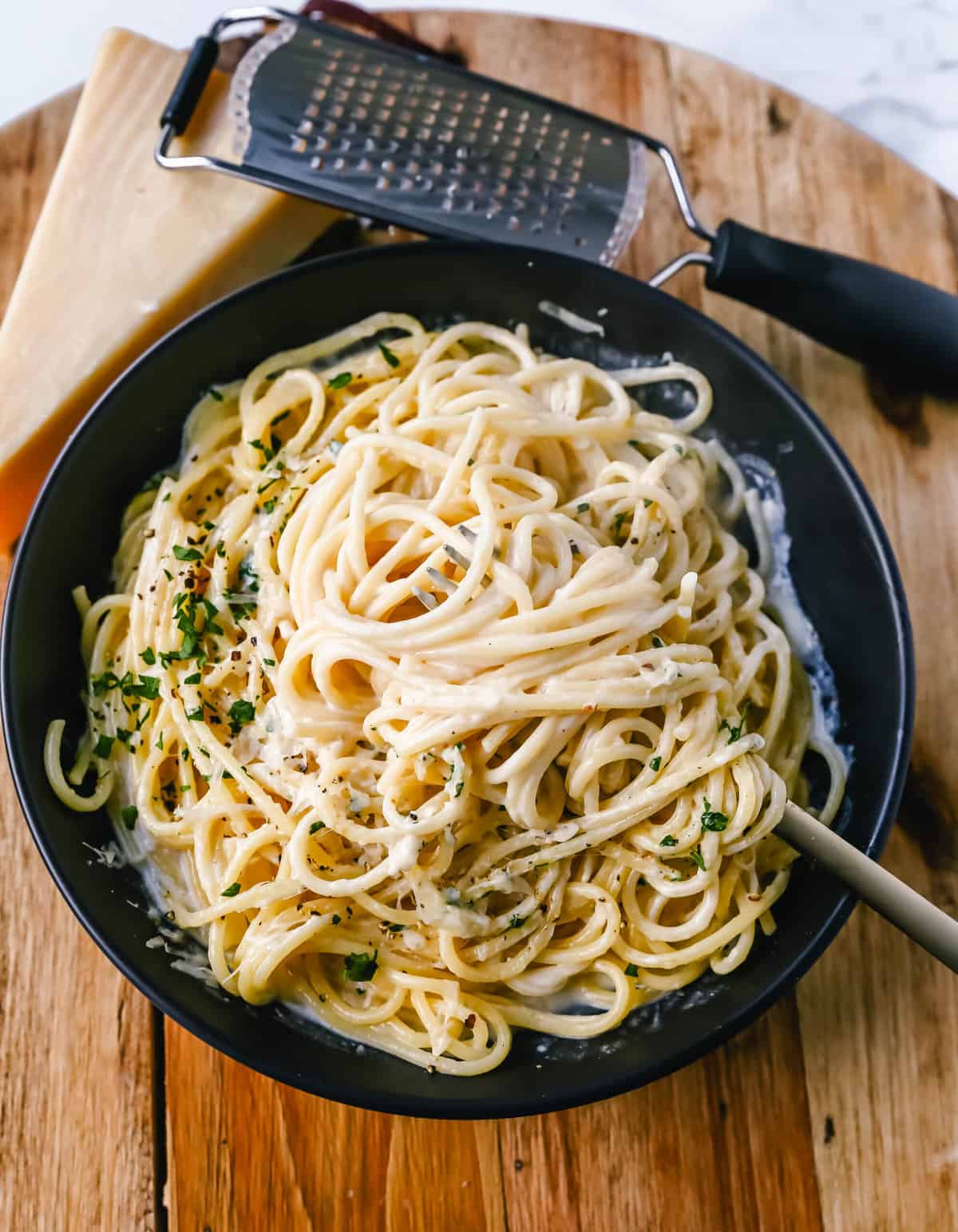 Break-Up Pasta is a creamy 3-Cheese Spaghetti Recipe made with butter, garlic, cream, broth, Italian cheeses, spices, and tossed in spaghetti. It is the best creamy spaghetti recipe known to help cure breakups!