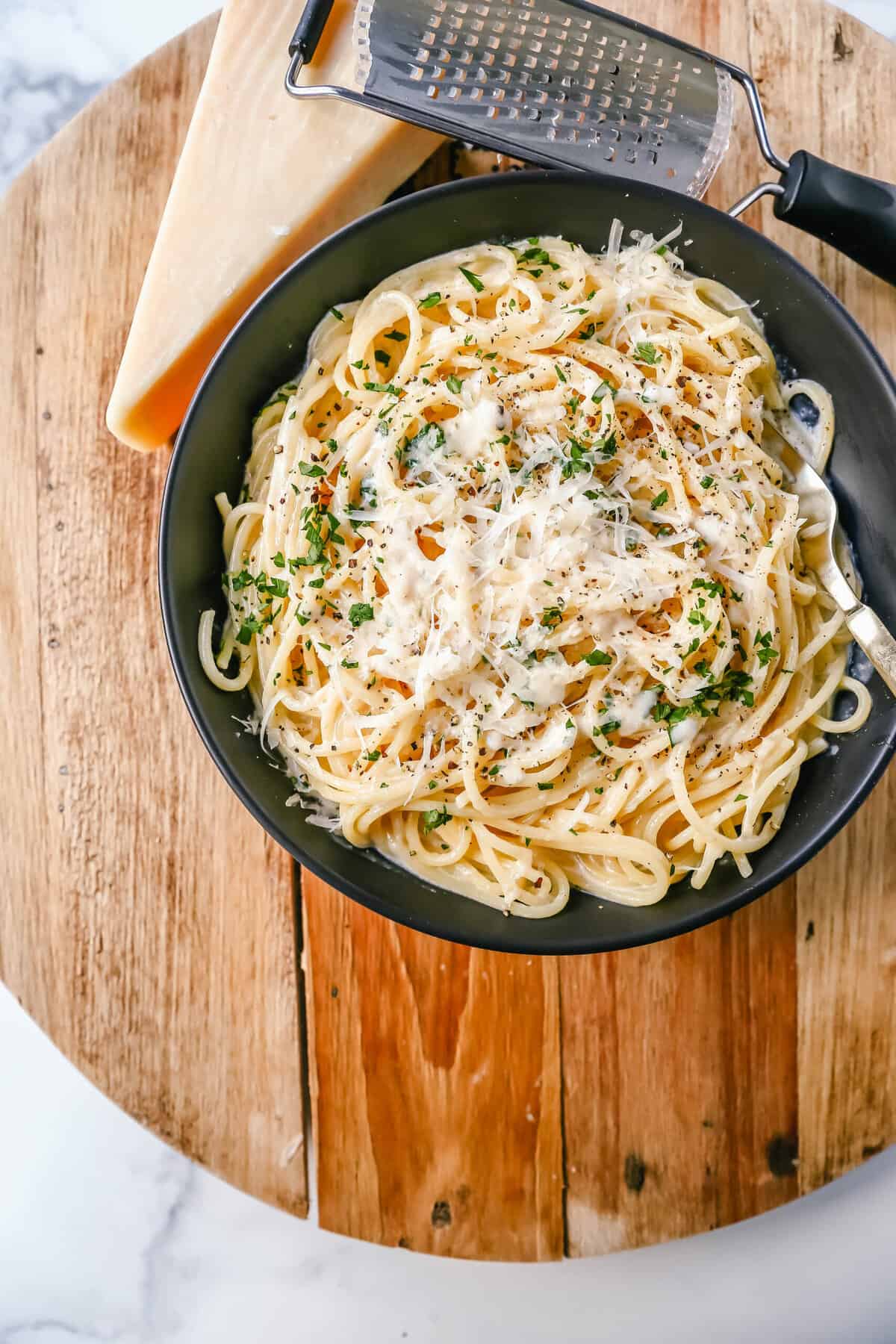 Break-Up Pasta is a creamy 3-Cheese Spaghetti Recipe made with butter, garlic, cream, broth, Italian cheeses, spices, and tossed in spaghetti. It is the best creamy spaghetti recipe known to help cure breakups!