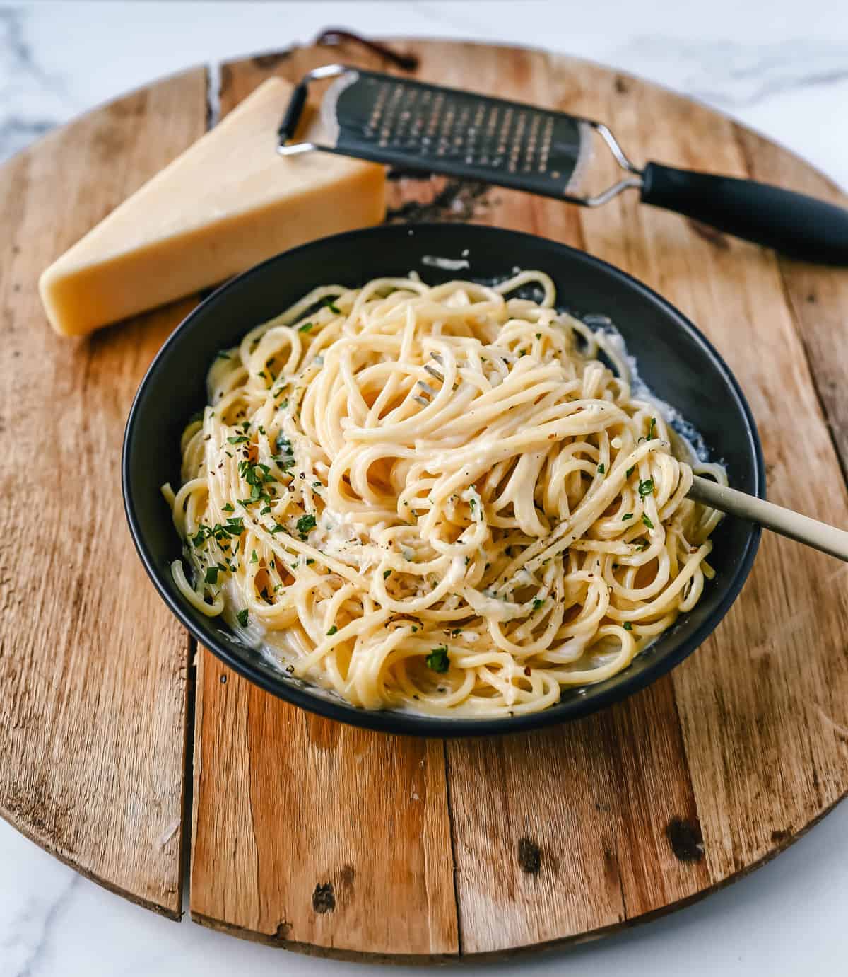 Break-Up Pasta is a creamy 3-Cheese Spaghetti Recipe made with butter, garlic, cream, broth, Italian cheeses, spices, and tossed in spaghetti. It is the best creamy spaghetti recipe known to help cure breakups!