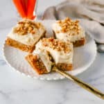 These soft, chewy carrot cake bars with cream cheese frosting are perfect for your Spring gathering. These carrot cake blondies taste even better than carrot cake!