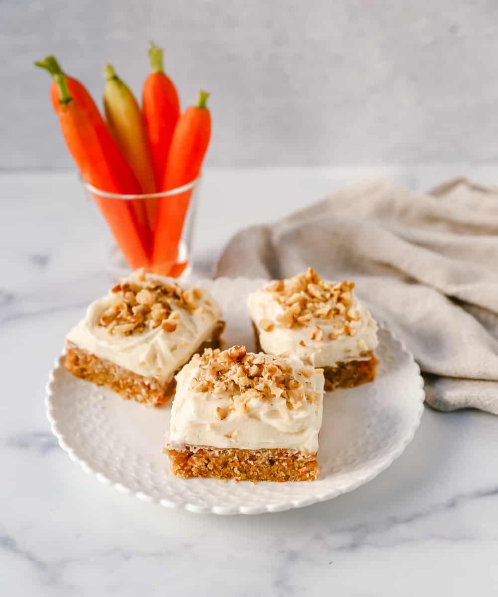 These soft, chewy carrot cake bars with cream cheese frosting are perfect for your Spring gathering. These carrot cake blondies taste even better than carrot cake!