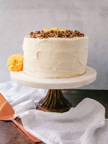 This Hummingbird Cake is a classic Southern dessert. This moist cake is made with pineapple, bananas, pecans, and frosted with a sweet cream cheese frosting.