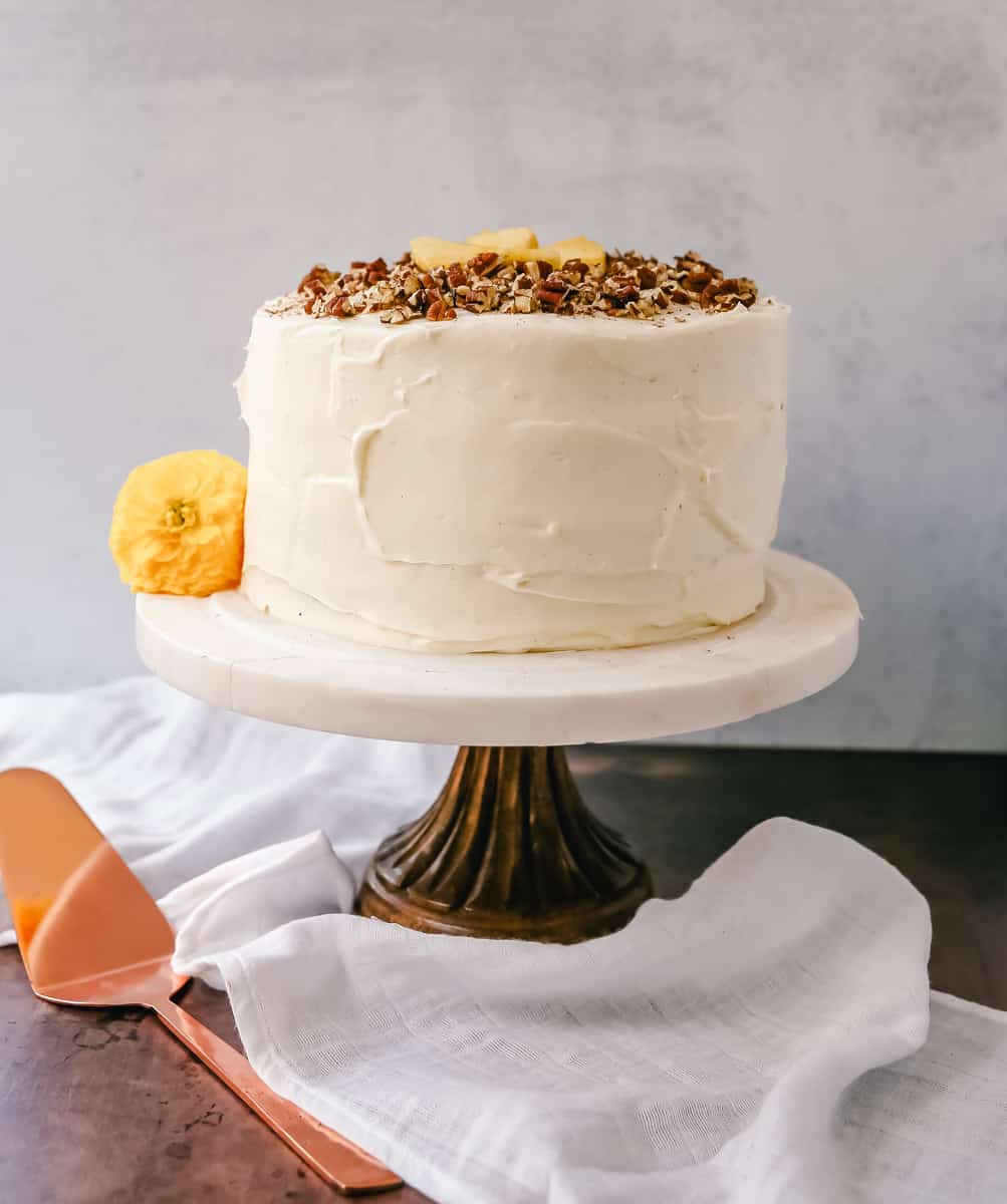 This Hummingbird Cake is a classic Southern dessert. This moist cake is made with pineapple, bananas, pecans, and frosted with a sweet cream cheese frosting.