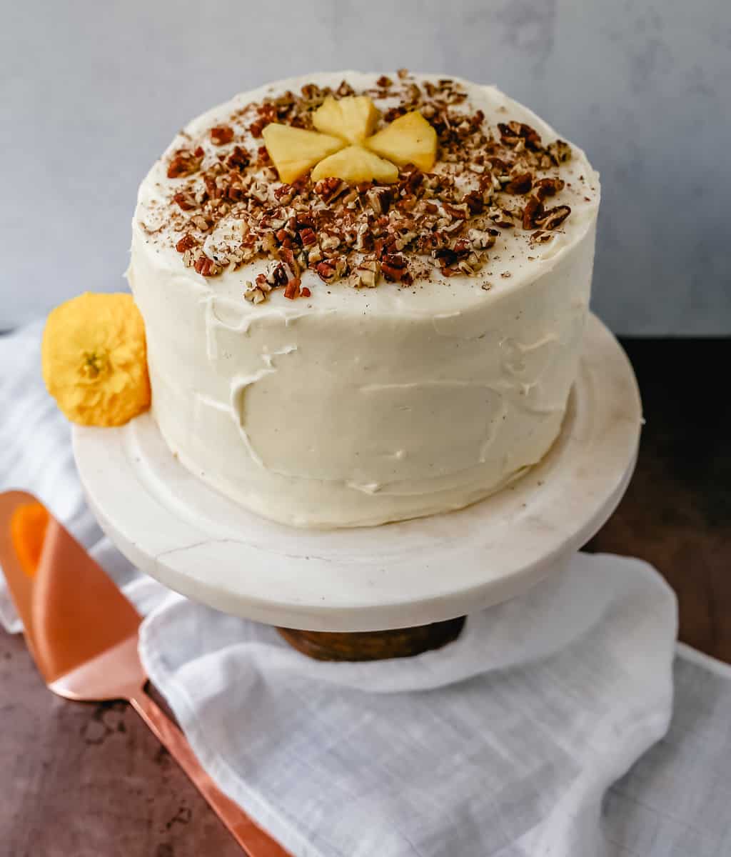 This Hummingbird Cake is a classic Southern dessert. This moist cake is made with pineapple, bananas, pecans, and frosted with a sweet cream cheese frosting.