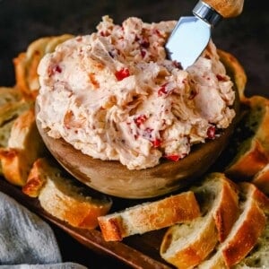 This pimento cheese dip is famous in the South for good reason. This pimento dip is made with cream cheese, mayonnaise, two types of cheddar cheeses, chopped pimentos, cayenne pepper, and a touch of salt. 