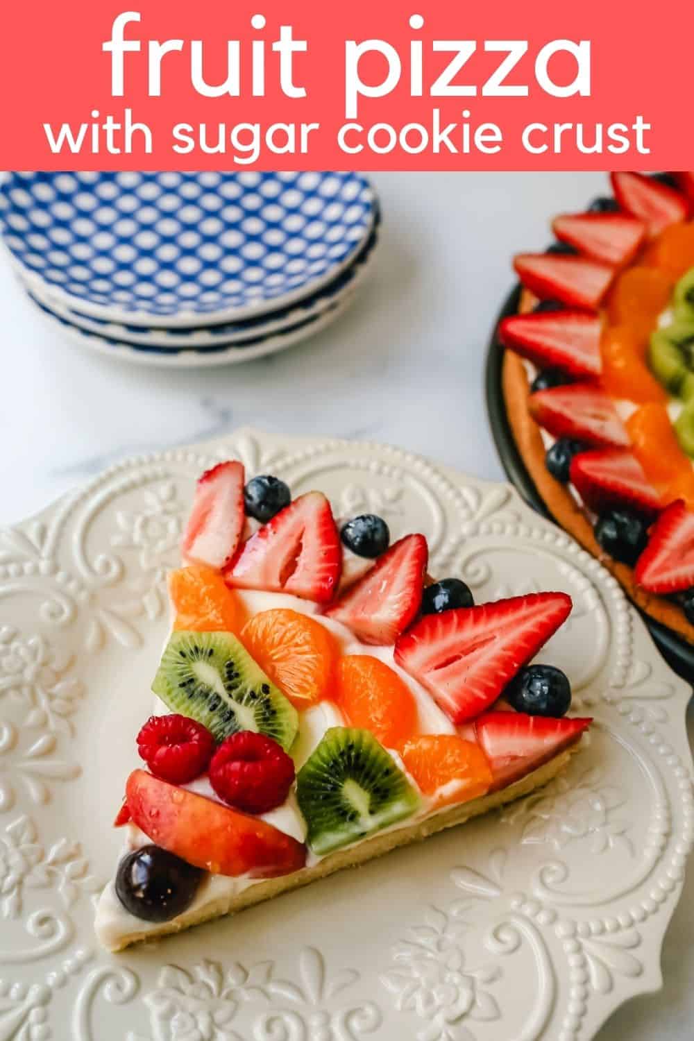 Fruit Pizza with a Sugar Cookie Crust is made with a large, pizza-sized baked sugar cookie and topped with a sweet cream cheese whipped cream and sprinkled with glazed fresh fruit. 