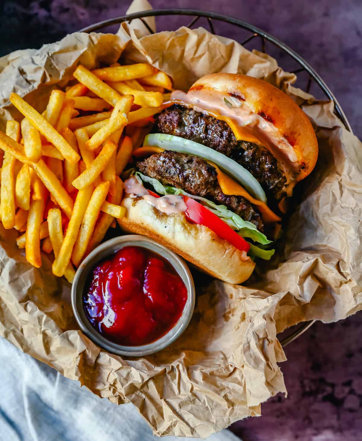 Classic All-American Cheeseburger with Cheddar Cheese and topped with burger sauce, lettuce, tomatoes, and onion. How to make the best homemade grilled cheeseburger...just like the In-N-Out Double-Double!