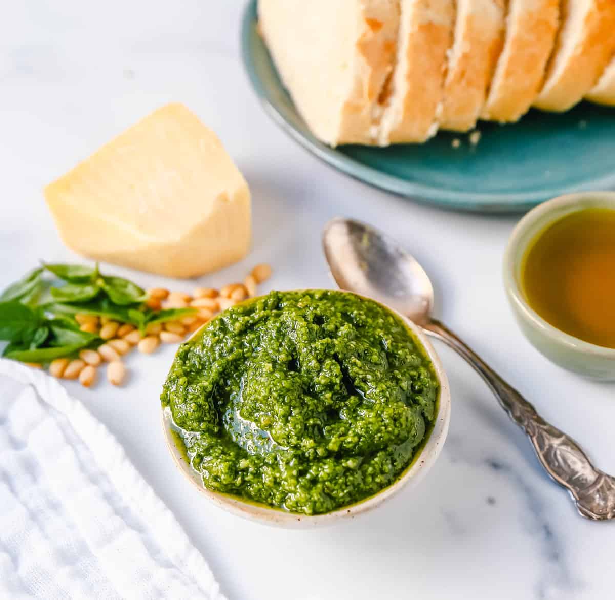 Homemade Basil Pesto Sauce made with fresh basil, extra-virgin olive oil, pine nuts, garlic, parmesan cheese, and salt and pepper. This pesto sauce is the best recipe and can be used on pasta, pizza, sandwiches, or to be used as a dip with rustic French bread.