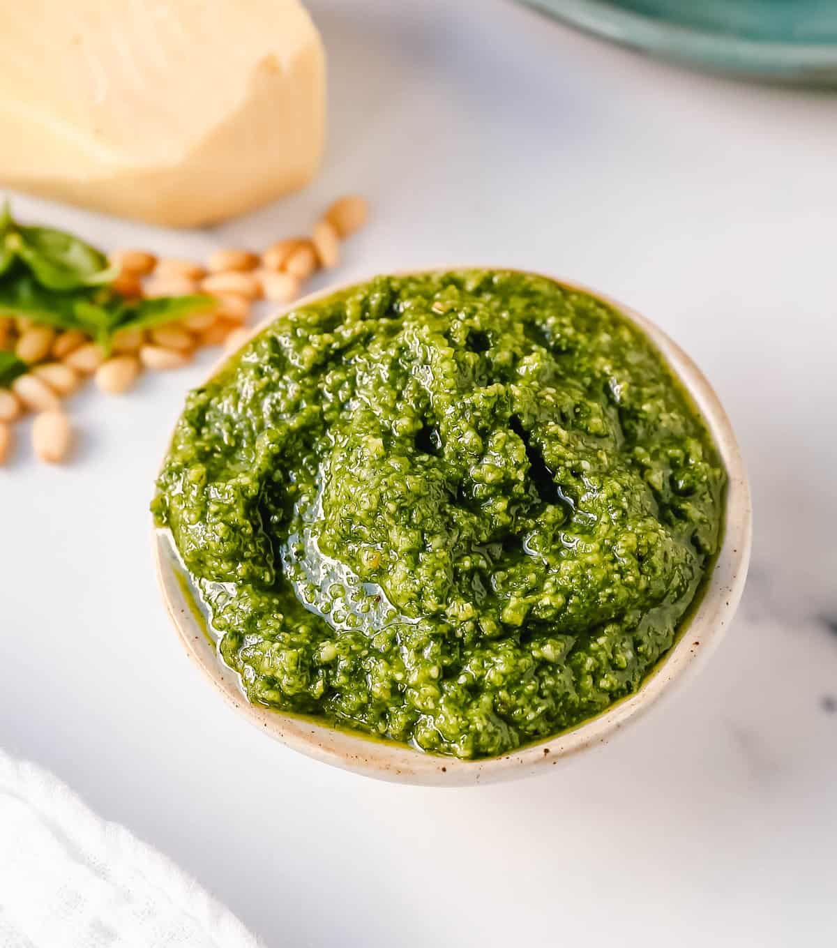 Homemade Basil Pesto Sauce made with fresh basil, extra-virgin olive oil, pine nuts, garlic, parmesan cheese, and salt and pepper. This pesto sauce is the best recipe and can be used on pasta, pizza, sandwiches, or to be used as a dip with rustic French bread.