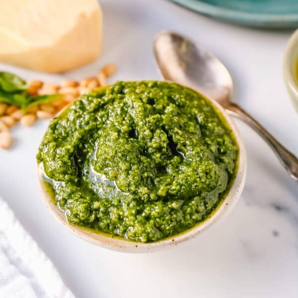 Homemade Basil Pesto Sauce made with fresh basil, extra-virgin olive oil, pine nuts, garlic, parmesan cheese, and salt and pepper. This pesto sauce is the best recipe and can be used on pasta, pizza, sandwiches, or to be used as a dip with rustic French bread.