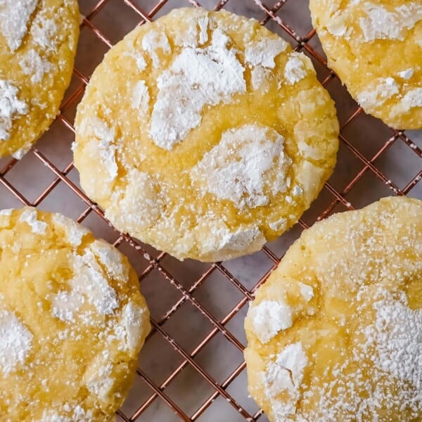 Soft chewy lemon cookies with fresh lemon juice, lemon zest, and lemon extract to give them the extra lemon tang! These lemon crinkle cookies are rolled in powdered sugar and baked until soft and chewy. The best lemon cookie recipe!