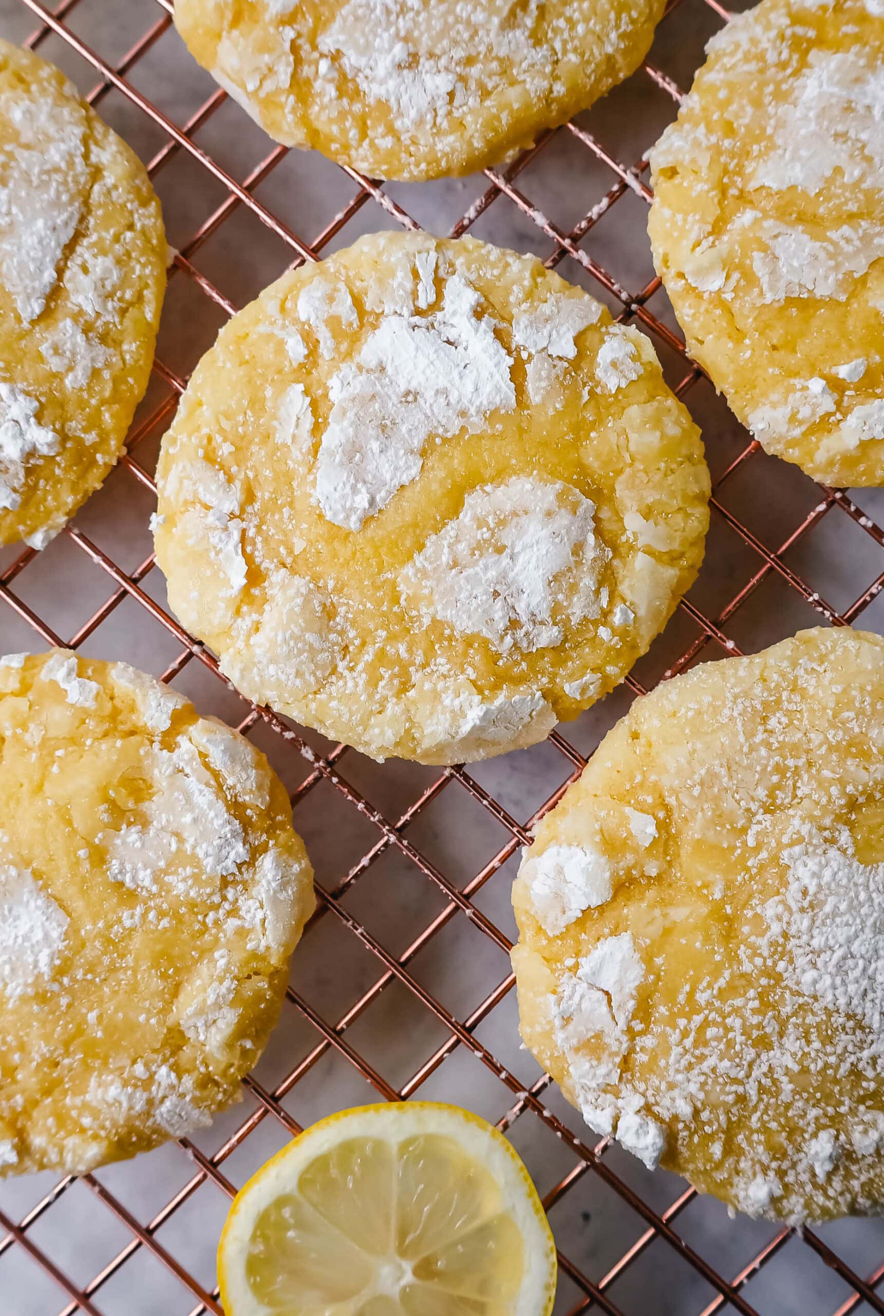 Soft chewy lemon cookies with fresh lemon juice, lemon zest, and lemon extract to give them the extra lemon tang! These lemon crinkle cookies are rolled in powdered sugar and baked until soft and chewy. The best lemon cookie recipe!