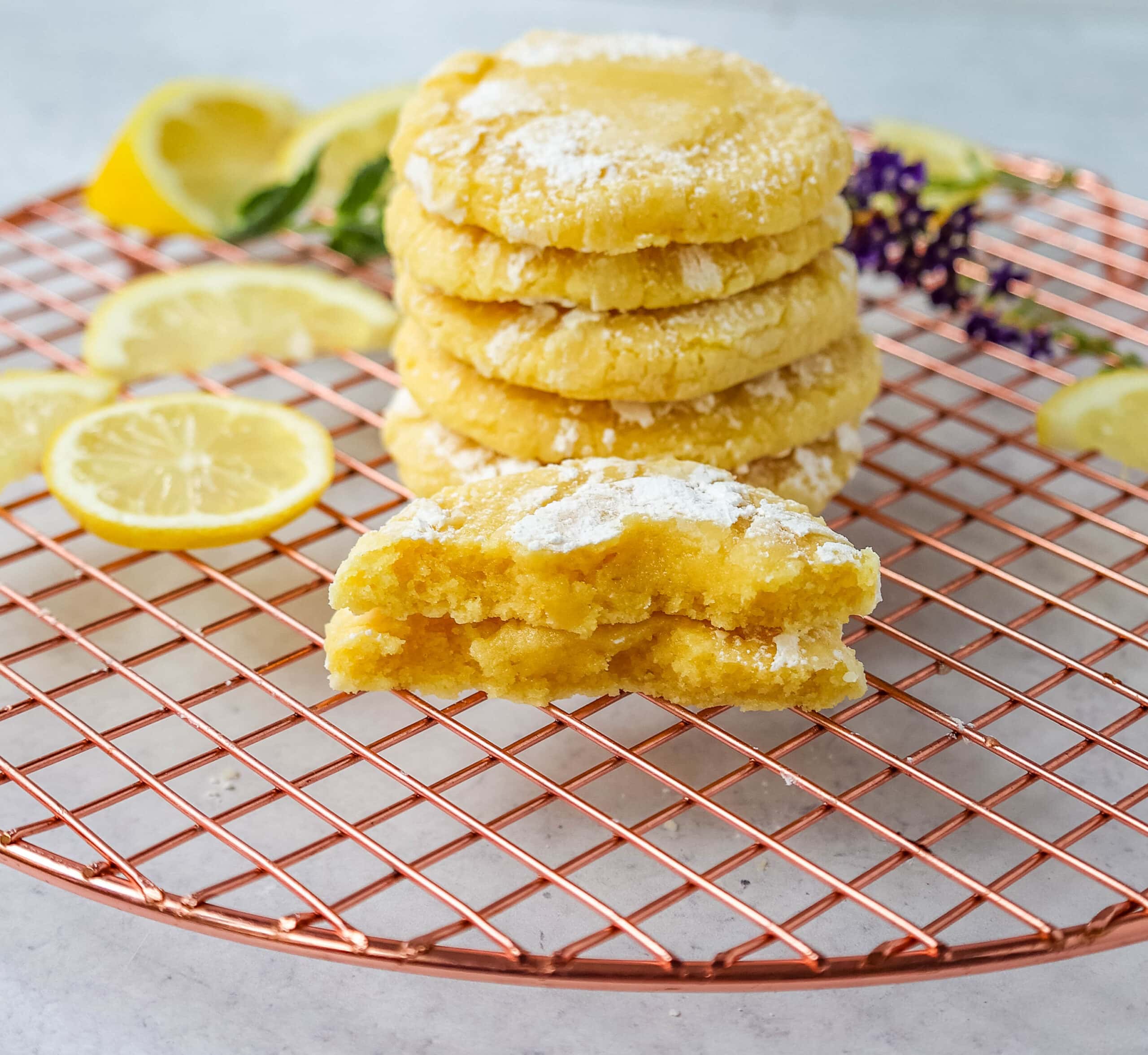 Soft chewy lemon cookies with fresh lemon juice, lemon zest, and lemon extract to give them the extra lemon tang! These lemon crinkle cookies are rolled in powdered sugar and baked until soft and chewy. The best lemon cookie recipe!