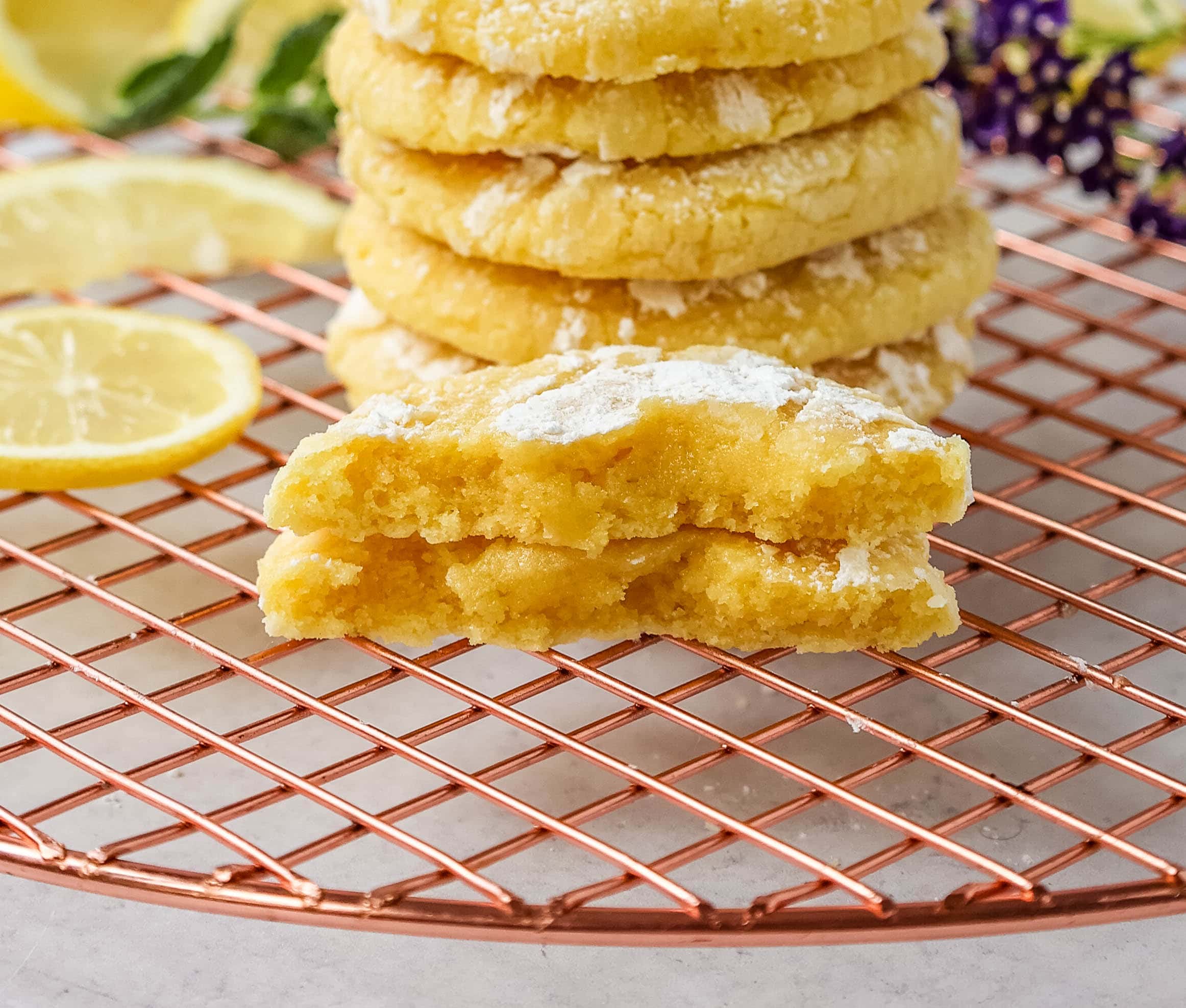 Soft chewy lemon cookies with fresh lemon juice, lemon zest, and lemon extract to give them the extra lemon tang! These lemon crinkle cookies are rolled in powdered sugar and baked until soft and chewy. The best lemon cookie recipe!