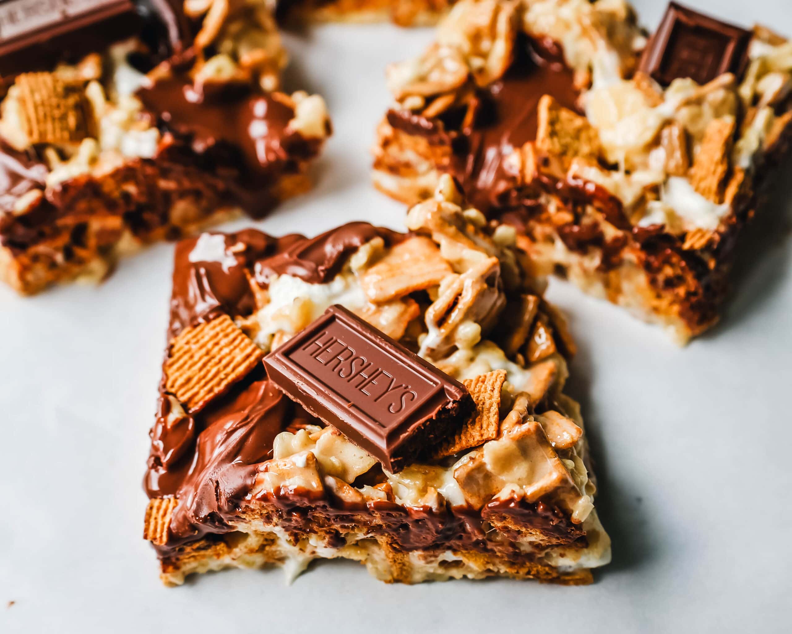 S'more Rice Krispie Treats made with Golden Graham, Rice Krispies, Marshmallows, Butter, and Hershey's Milk Chocolate Bars. The perfect S'more Rice Krispies that can be made in less than 15 minutes!