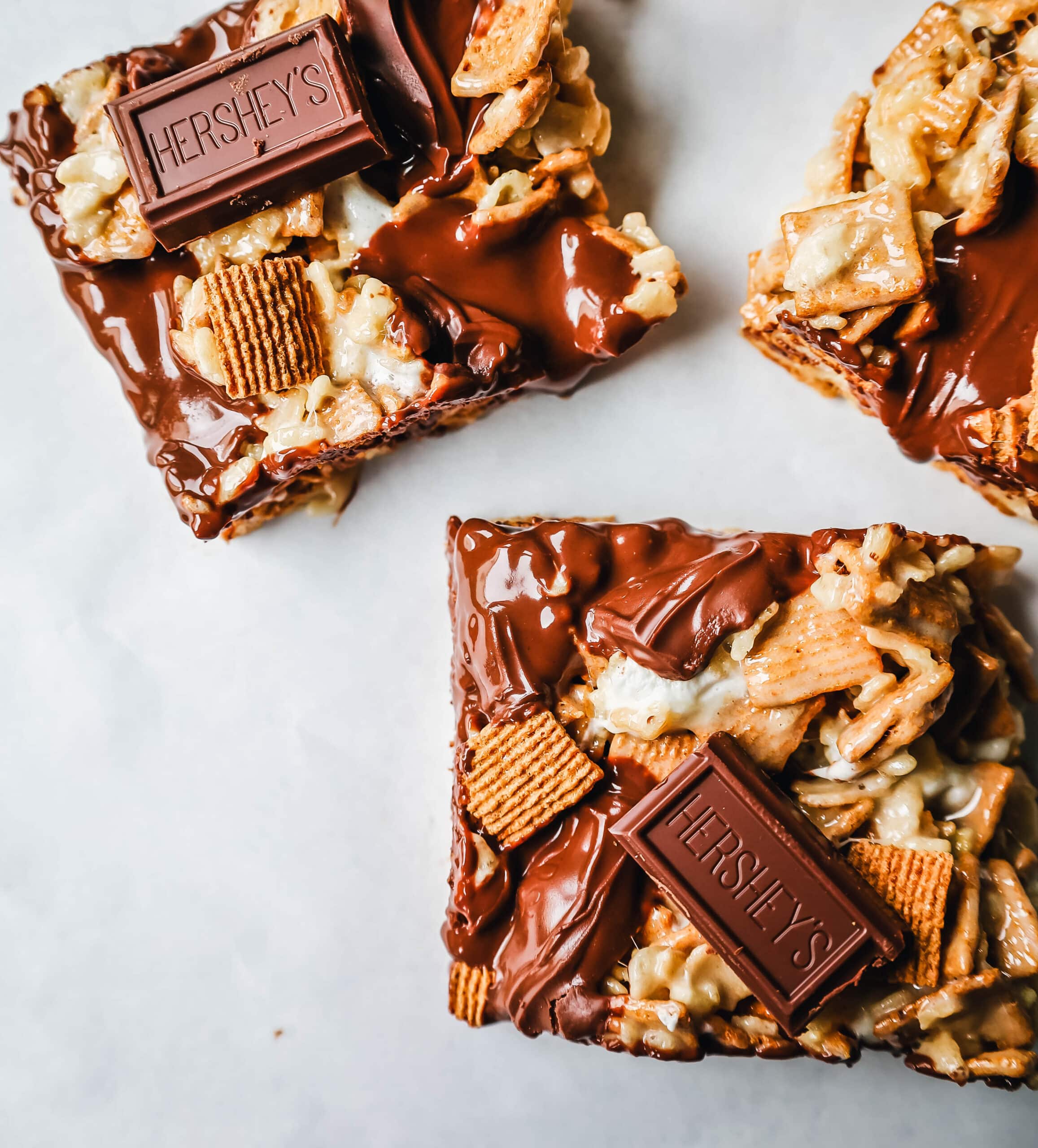 S'more Rice Krispie Treats made with Golden Graham, Rice Krispies, Marshmallows, Butter, and Hershey's Milk Chocolate Bars. The perfect S'more Rice Krispies that can be made in less than 15 minutes!