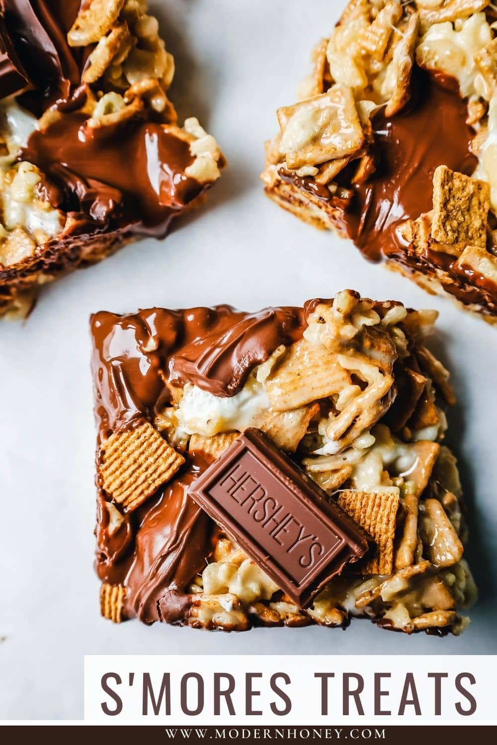 S'more Rice Krispie Treats made with Golden Graham, Rice Krispies, Marshmallows, Butter, and Hershey's Milk Chocolate Bars. The perfect S'more Rice Krispies that can be made in less than 15 minutes!