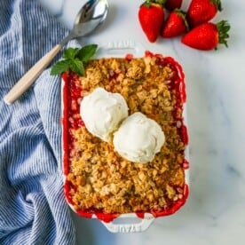 This Strawberry Crisp is made with fresh sweetened strawberries topped with a homemade buttery oat crumble topping. A Homemade Strawberry Crumble is an easy summer dessert.