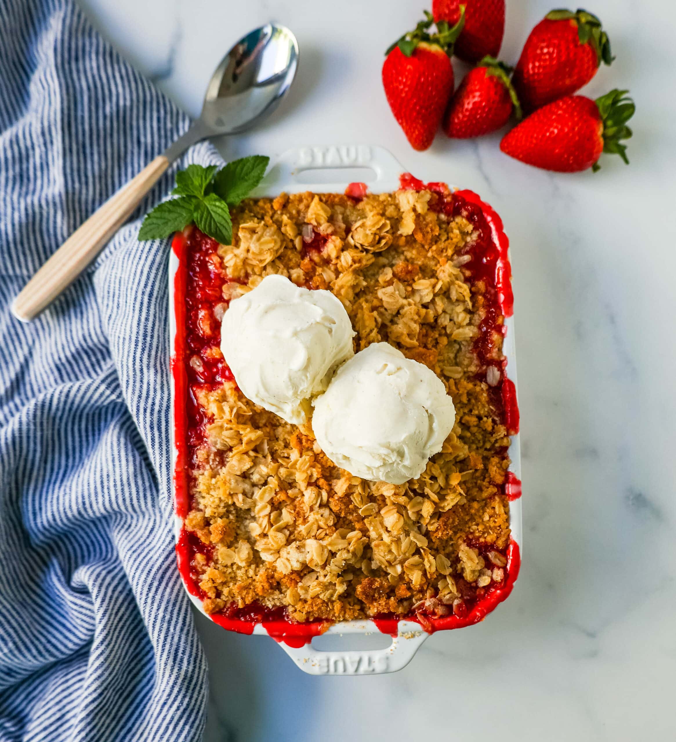 This Strawberry Crisp is made with fresh sweetened strawberries topped with a homemade buttery oat crumble topping. A Homemade Strawberry Crumble is an easy summer dessert. 