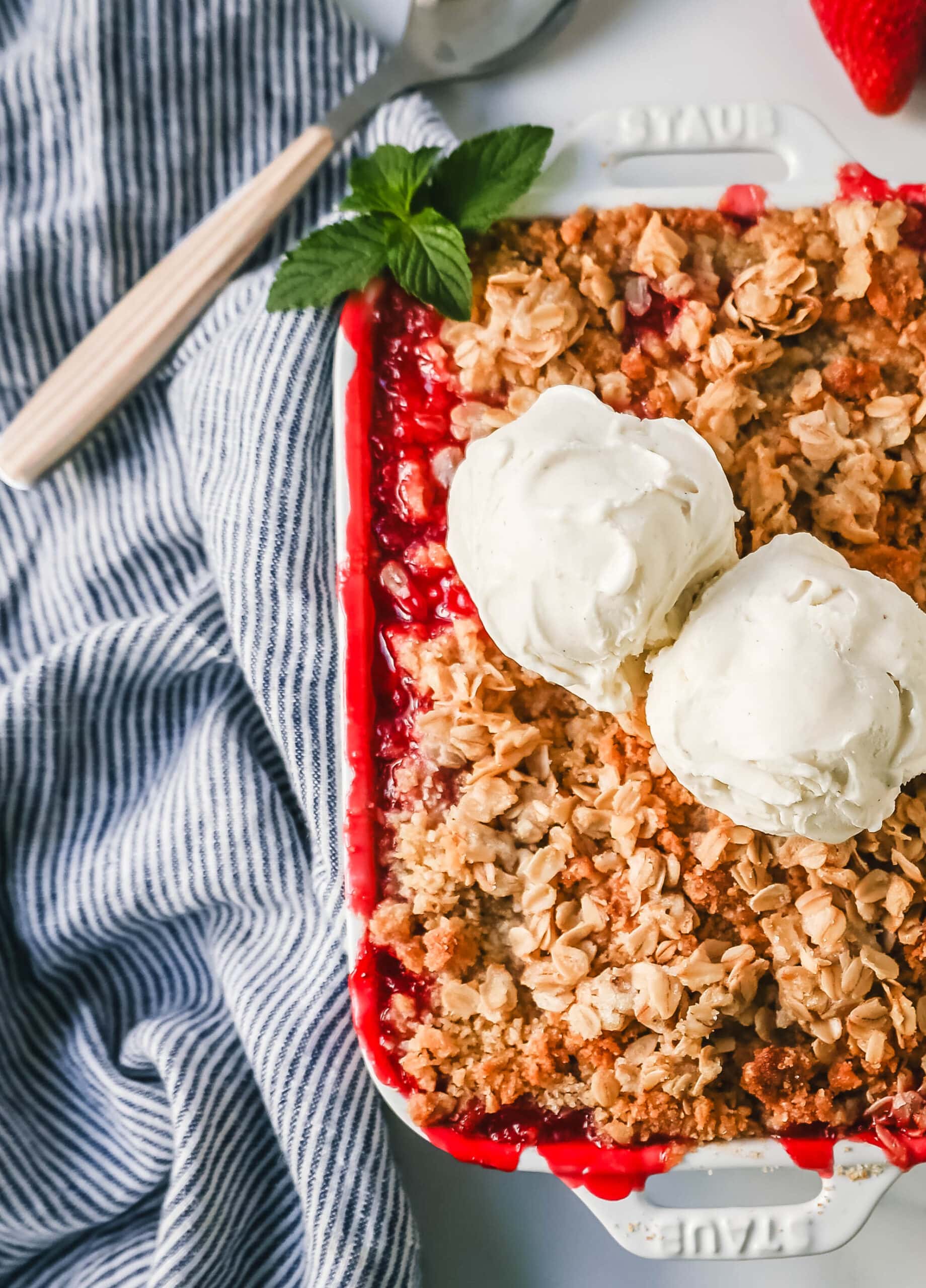 This Strawberry Crisp is made with fresh sweetened strawberries topped with a homemade buttery oat crumble topping. A Homemade Strawberry Crumble is an easy summer dessert. 