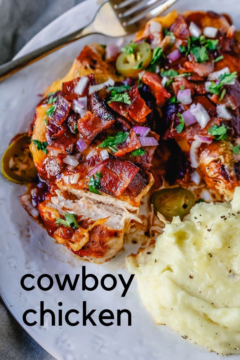 This Cowboy Chicken is Marinated Grilled Chicken topped with BBQ Sauce, Crispy Bacon, and Cheddar Cheese. Top with Fresh Cilantro and Red Onion. This is the best Monterey Chicken recipe!