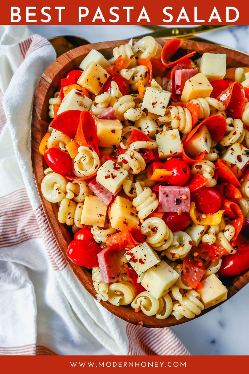 The best Classic Pasta Salad made with Italian meats, creamy cheeses, fresh vegetables, and all tossed in a creamy homemade Italian dressing. The perfect pasta salad recipe!