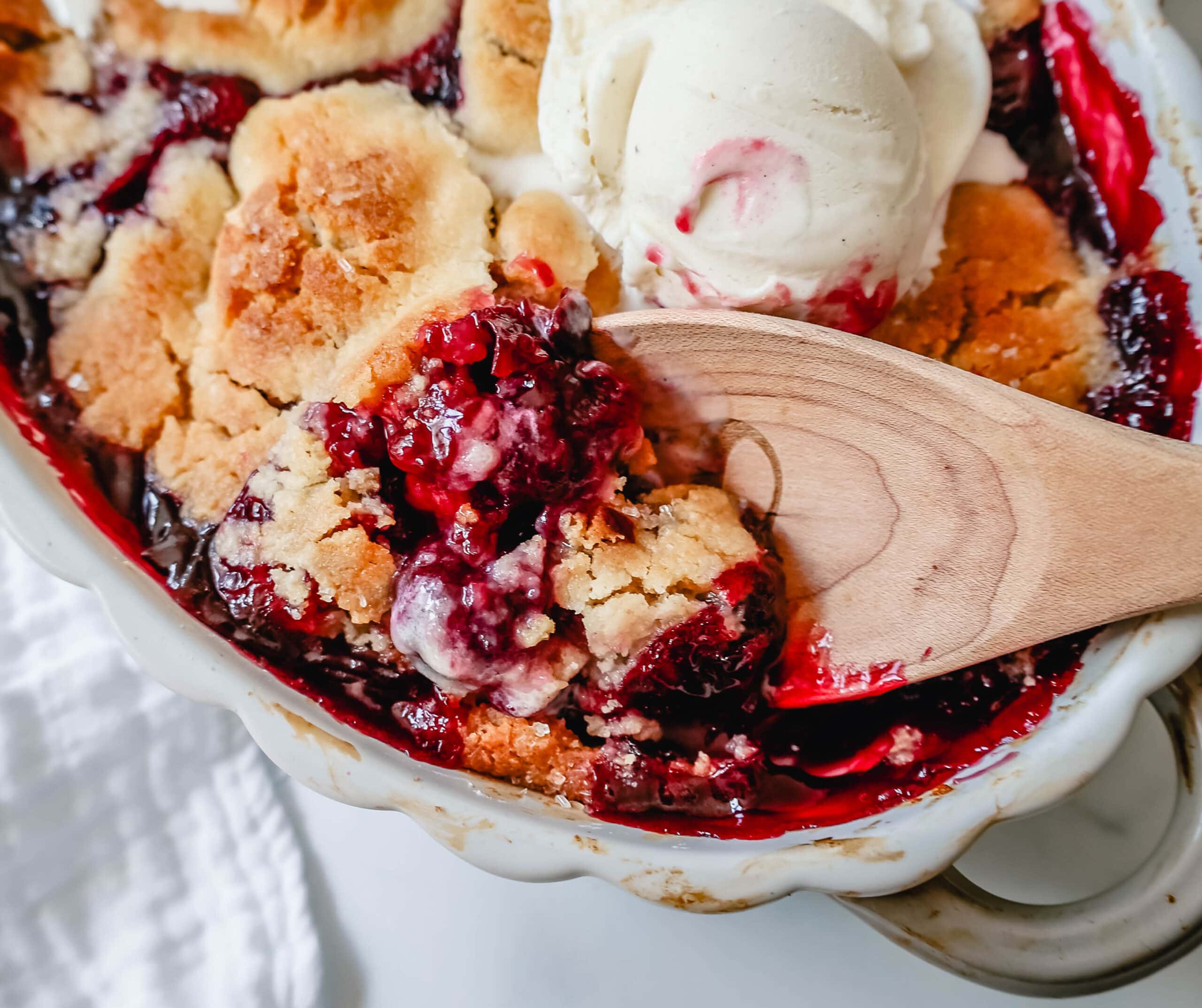 This is the Best Cherry Cobbler Recipe! This Old Fashioned Cherry Cobbler is made with fresh cherries lightly sweetened and topped with a homemade sweet and buttery cobbler crust. You are going to love this easy cherry cobbler recipe!