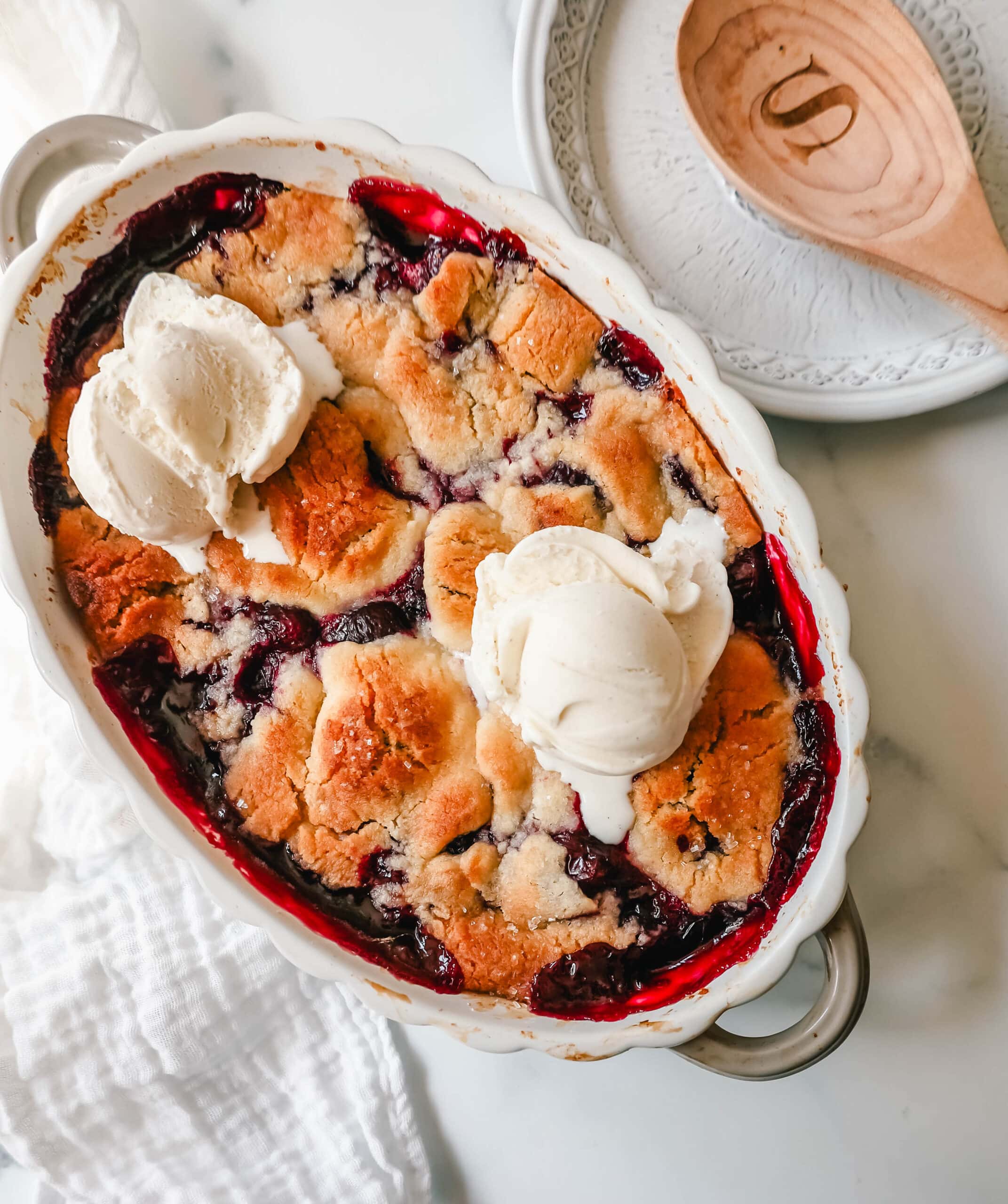 This is the best cherry cobbler recipe!  This old-fashioned cobbler is made with fresh, slightly sweetened cherries and is topped with a sweet, buttery, homemade cobbler crust.  You will love this easy cherry cobbler recipe!