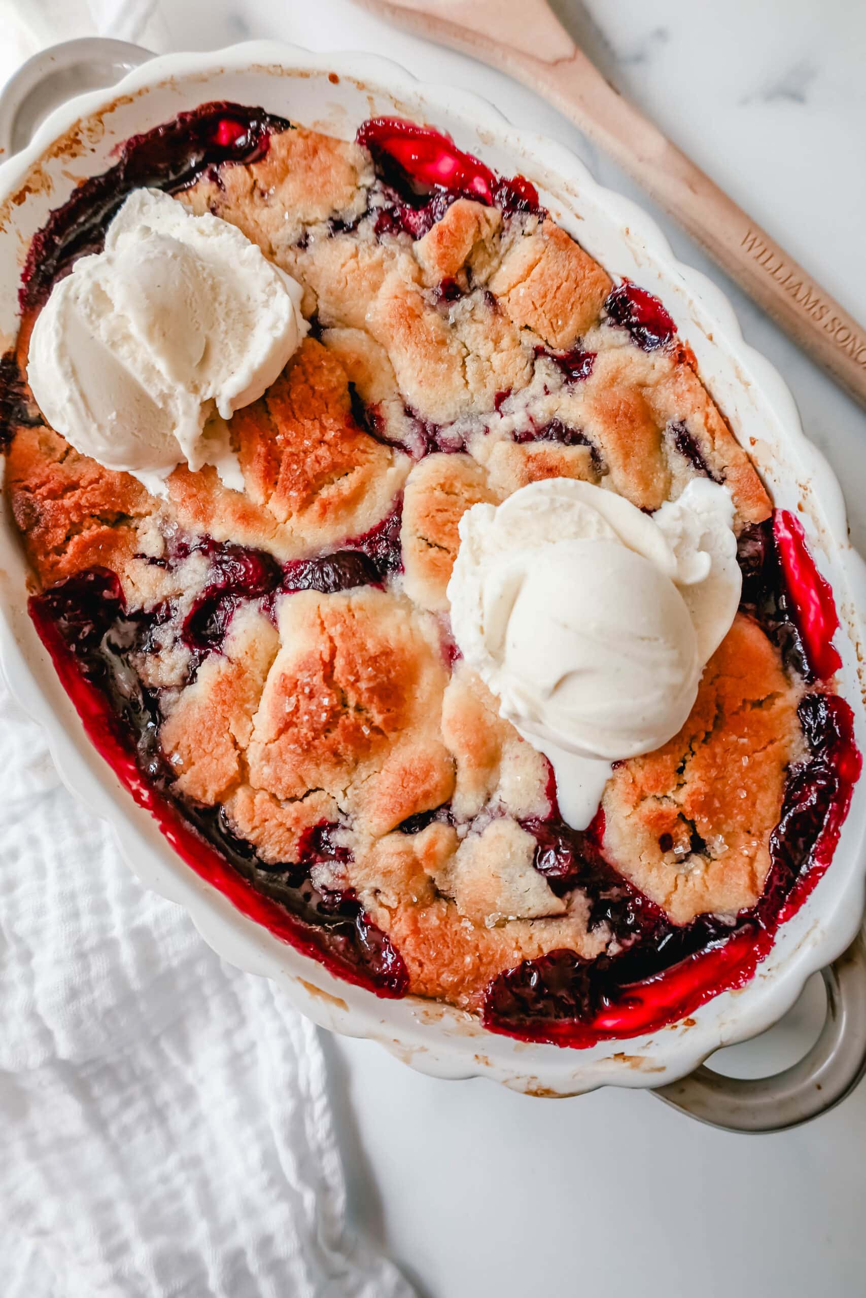This is the Best Cherry Cobbler Recipe! This Old Fashioned Cherry Cobbler is made with fresh cherries lightly sweetened and topped with a homemade sweet and buttery cobbler crust. You are going to love this easy cherry cobbler recipe!