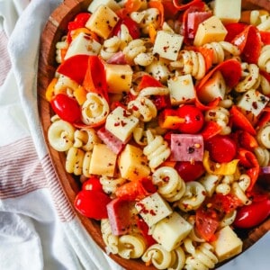 The best Classic Pasta Salad made with Italian meats, creamy cheeses, fresh vegetables, and all tossed in a creamy homemade Italian dressing. The perfect pasta salad recipe!