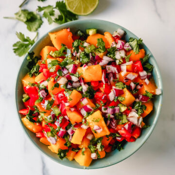 Homemade Fresh Mango Salsa with ripe mango, red peppers, cilantro, red onion, jalapeno, lime juice, salt, and a touch of honey. The freshest and best mango salsa recipe!