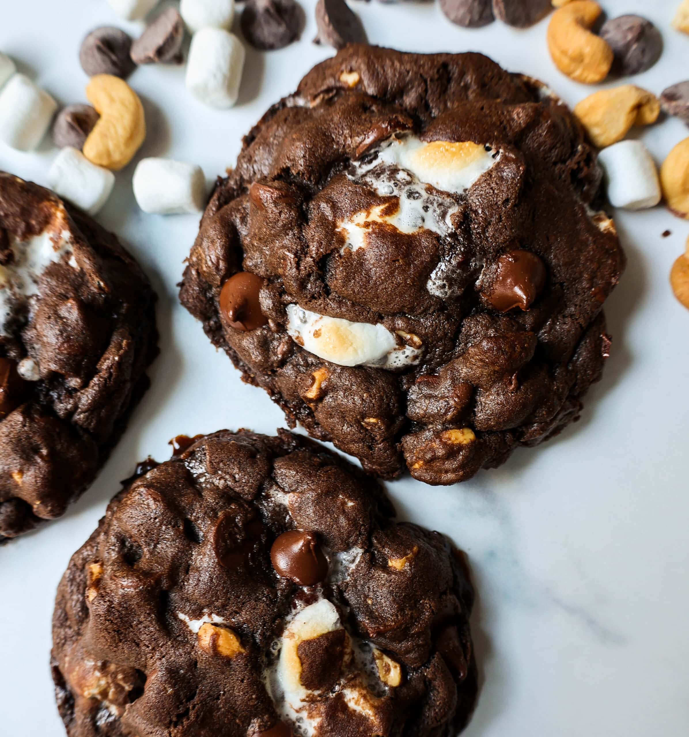 These Levain Bakery Rocky Road Cookies are rich, thick, soft, chewy chocolate cookies with semi-sweet chocolate chips, mini marshmallows, and cashews. The best Levain Bakery Copycat Rocky Road Cookie Recipe!