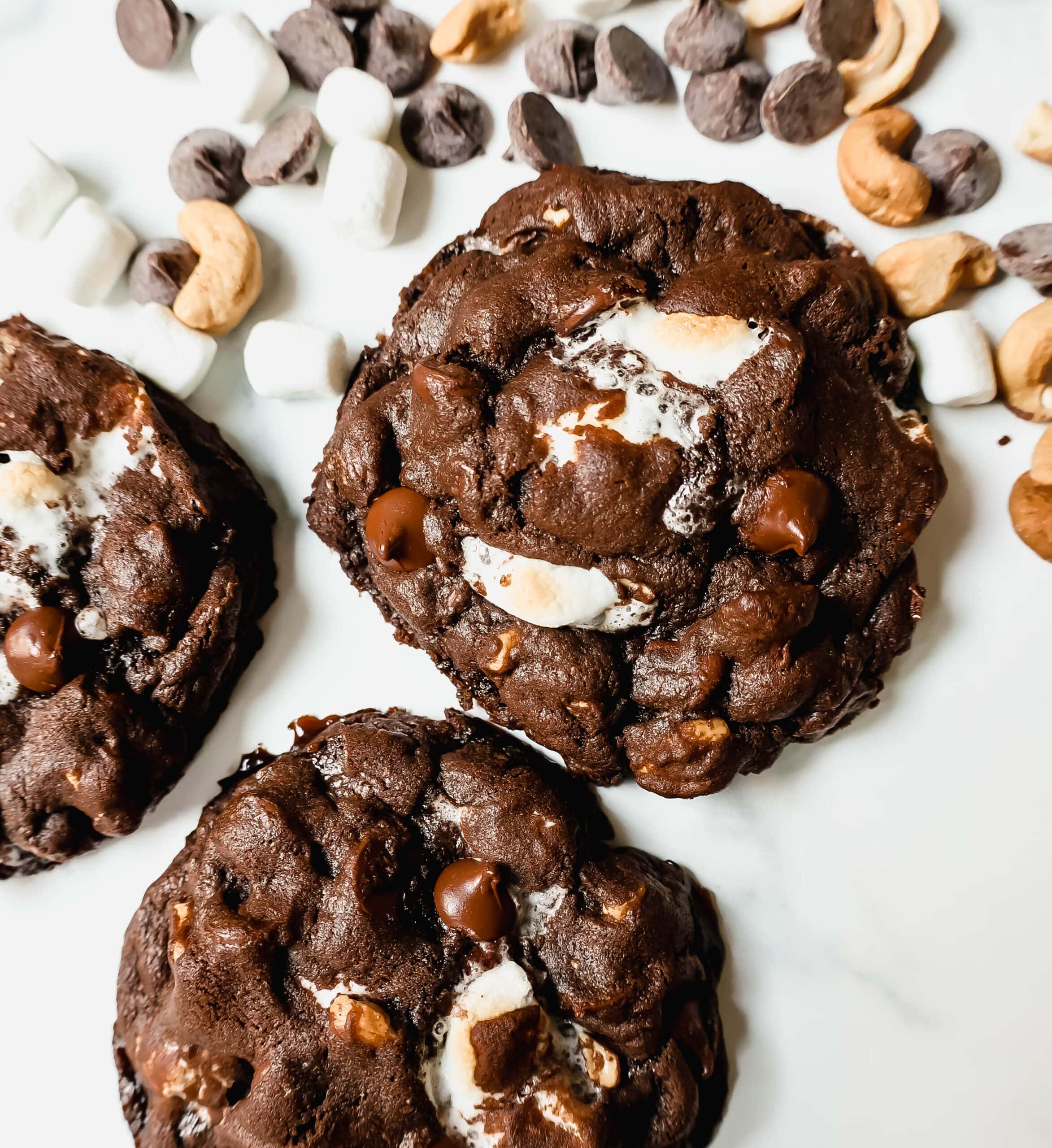 These Levain Bakery Rocky Road Cookies are rich, thick, soft, chewy chocolate cookies with semi-sweet chocolate chips, mini marshmallows, and cashews. The best Levain Bakery Copycat Rocky Road Cookie Recipe!